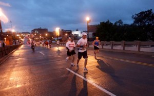 Kuck_OkC_Start RMRR runner Kerry Kuck and Achilles Track Club guide Matt Guidry posted a 4:39:26 time in the April 27th, 2008 8th annual OKC Memorial Marathon “Run to Remember”. It was 49 degrees at the 6:30am pre-dawn race start, with drizzle and 20-30 mph winds. The rain and clouds gradually lifted throughout the morning, to sun in the afternoon. Photo by Sarah Phipps, published April 28, 2008. Copyright 2008, The Oklahoma Publishing Company.